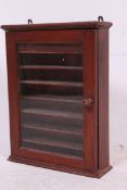 A vintage Twentieth century Mahogany shop haberdashers hanging cabinet with door to front .