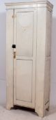 A mid 20th century vintage painted school cupboard having plinth base with upright full length door