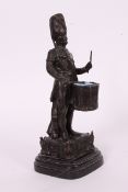 A bronze figure of a military drummer boy standing on marble base signed to rear ' Par Brouchon '