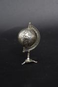 An unusual small silver continental 900 marked desk top globe on tripod stand. Total weight 13.