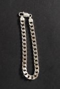 A 925 white metal silver braclet with chain link band and clasp.