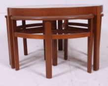 A retro Nathan teak wood and glass quartetto nest of tables to include large circular main table.