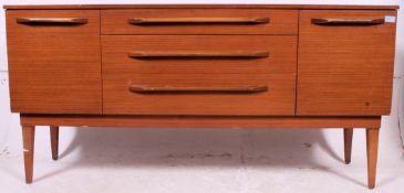 A retro teak affect sideboard by Stonehill Furniture having a bank of three central drawers being