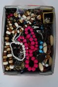 A large quantity of assorted costume jewellery to include necklaces, pendants etc.