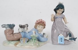 A Lladro Figure ' Study Buddies ' Model Number 5451 together with another Nao by Lladro figurine No