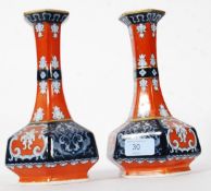 A pair of 19th century Staffordshire Imari style bulbous solifleur / stem vases having ochre red