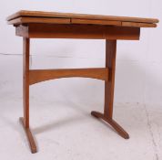 A stunning 1950's formica and beech wood vintage / retro draw leaf dining table with applied