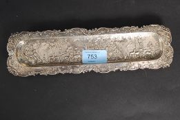 A Victorian silver hallmarked pen tray by Samuel Boyce Landeck of continental origin having village