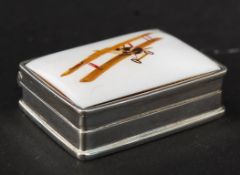 A 925 white metal silver and enamel set pill box depicting a bi-plane. Weight: 27g GW.