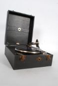 A vintage portable wind up gramophone, within the original case.