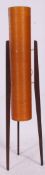 A 1950's teak and fibre glass sputnik / rocket lamp raised on angled teak supports with original