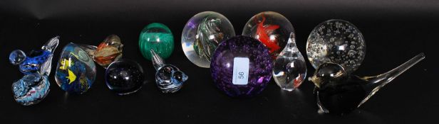 A collection of 13x assorted glass paperweights to include control bubble, fish, birds and others.