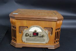 A contempory vintage style cabinet radiogram with built in tape player