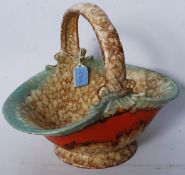 A 20th century Beswick ? Serial No 14224 posy basket complete with handle being marked to the base