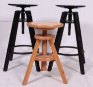 2 ebonised adjustable contemporary wooden stools with swivel tops together with a similar plain