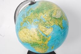 A 20th century retro desk top globe illuminating over plinth base with swivel action