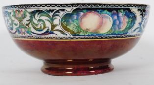 A Maling 1930's Ceramic lustre fruit bowl in orange being marked to the base