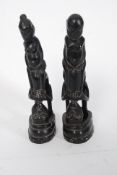 A pair of good Indonesian 20th century carved horn erotic figures raised on square plinths