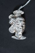 A 20th century heavy set Sterling silver African tribal woman brooch stamped to verso with pin.