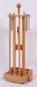 A 20th century garden Croquet set complete with original trolley. Measures: 96cm x 29cm x 25cm.