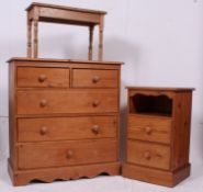 An antique style 20th century pine 2 over 3 chest of drawers together with a bedside table and a