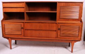 A 1970's teak wood Danish style sideboard - dresser cabinet raised on tapered supports having
