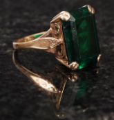 A 9ct gold antique ring, with large green central stone and fretworked shoulders.8.