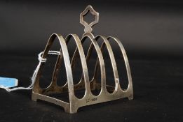 A hallmarked silver Walker & Hall, Birmingham 1948 letter / toast rack of small form. 49g.