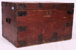 A Victorian wooden and metal strapped steamer trunk having hinged top with exterior metal