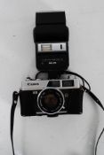 A cased vintage Cannon 35ml Cannonette camera  along with a flash unit