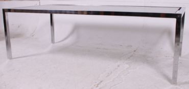 A 1970's retro large chrome and smoked glass rectangular coffee table raised squared chrome tubular