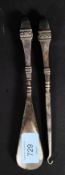 A hallmarked silver handled hook and eye set - the handles being of raised design with hallmarks to