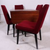 A 1960's drop leaf teak wood dining table together with the 4 matching dining chairs,