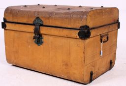 A good 19th century metal steamer trunk of dome form having hinged top bearing the original yellow