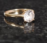 A ladies 9ct gold hallmarked solitaire ring with central claw mounted stone. SIze N - Weight 1.