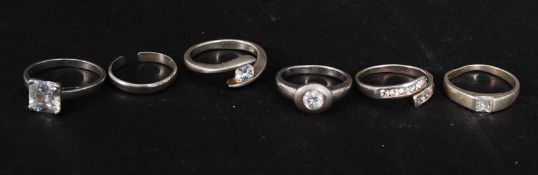 A collection of 6 contemporary silver rings to include claw mounted stone set,