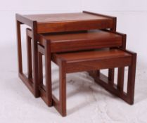 A Vintage Teak nest of Three tables on square banded supports/ legs. Measures: 43cm x 51cm x 43cm.