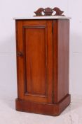 A Victorian mahogany and marble top bedside cabinet.