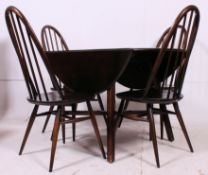 A 1970's retro  beech and elm Ercol dining room suite comprising drop leaf dining table together