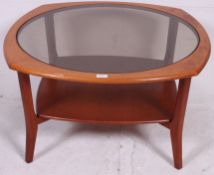 A Vintage Teak circular coffee table with smoked glass top.