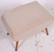 A good 1950's retro vintage upholstered sewing box ottoman being raised on turned supports with
