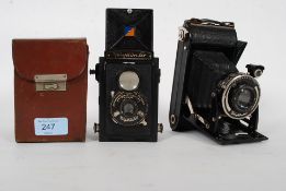 A collection of vintage voitlander folding cameras dating to the early 20th century ( see images )