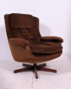 A retro G-Plan style teak and velour egg shaped swivel armchair.