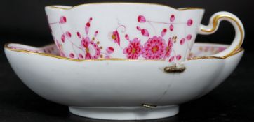 A Meissen Oval Scalloped Coffee Cup and saucer on white ground having red floral,