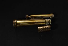 A good vintage early 20th century brass flint lighter in the shape of a bullet
