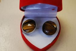 A pair of Silver and Tigers eye earrings. Weight: 4.