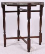 An early 20th century brass and oak barleytwist folding table / opium table of asiatic origin.