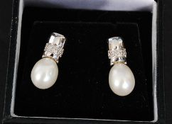 A pair of White Gold Diamond and cultured Pearl earrings. Weight: 3.