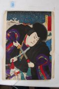 UTAGAWA KUNISADA ?. A 19th century Japanese woodblock on paper print of a warrior drawing his sword.