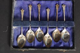 A cased set of 6 silver Art Deco hallmarked tea spoons by A J Bailey or A J Bailey & Son dating to